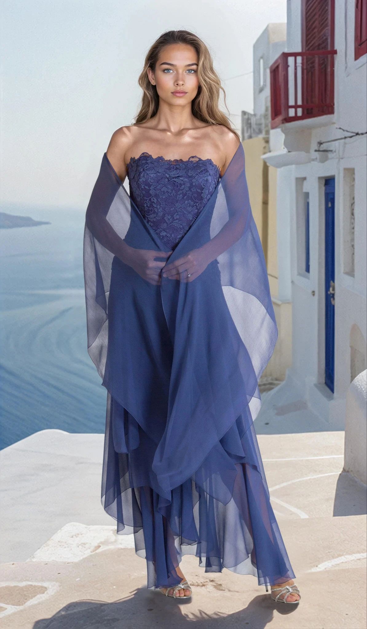 Woman in a blue strapless gown with stole standing in a scenic location.