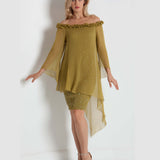 Woman wearing a green off-shoulder dress with sheer sleeves on a white background