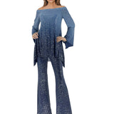 Women in a blue two-piece sequin outfit on a white background