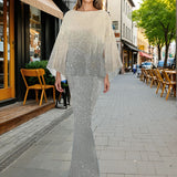 Woman standing in two piece ombre sequin set on a city street