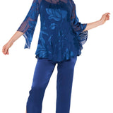 Woman wearing a blue floral top and pants on a white background