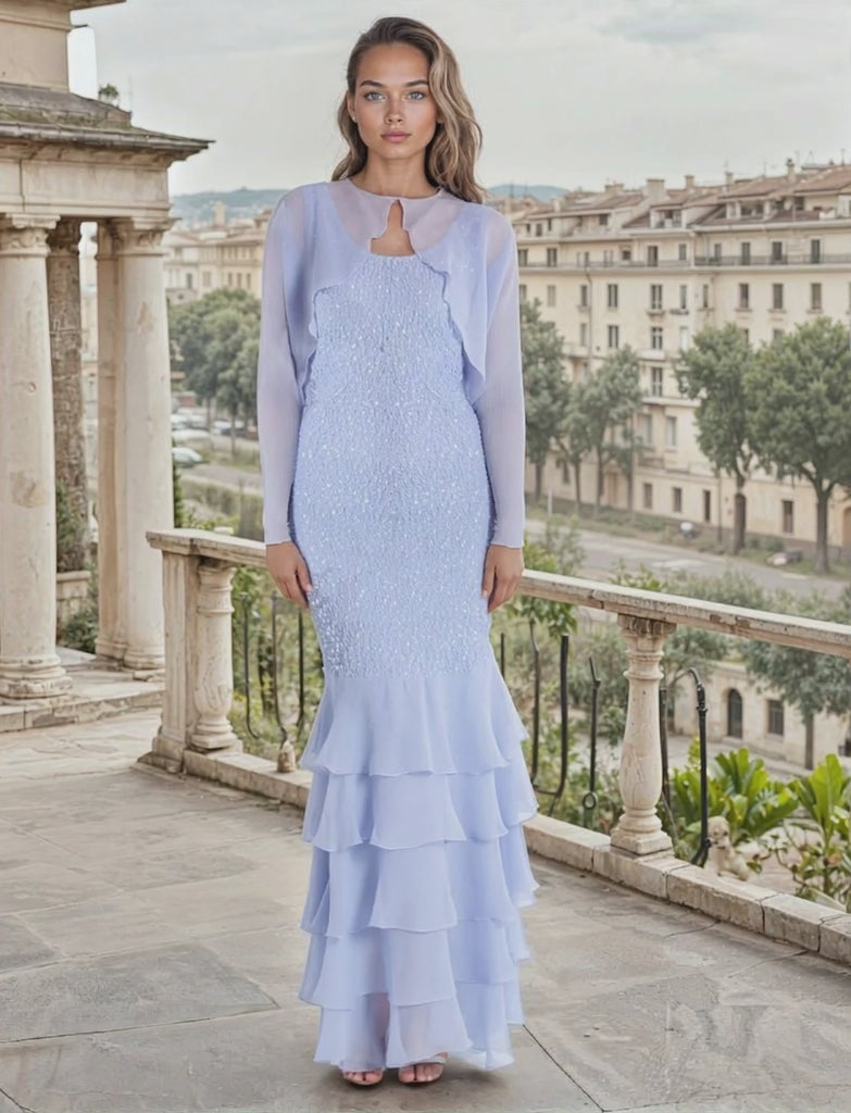 Woman in a light english violet dress standing on a balcony with a cityscape in the background